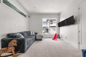 Living room featuring carpet flooring and baseboards