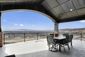 View of patio / terrace featuring outdoor dining space and a mountain view