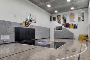 View of basketball court featuring basketball hoop