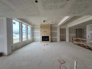 Unfurnished living room with a fireplace