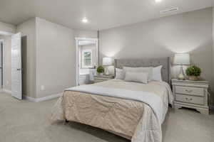Bedroom featuring visible vents, baseboards, and light colored carpet
