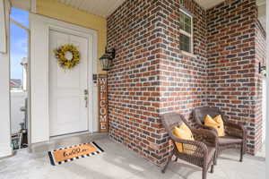 Property entrance with brick siding