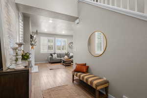Sitting room featuring recessed lighting, wood finished floors, baseboards, and a textured ceiling
