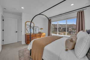 Bedroom with visible vents, recessed lighting, and carpet