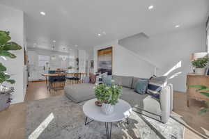 Living room featuring recessed lighting, light wood-style flooring, and baseboards