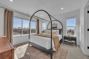 Bedroom with recessed lighting and baseboards