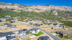 Birds eye view of property featuring a mountain view and a residential view