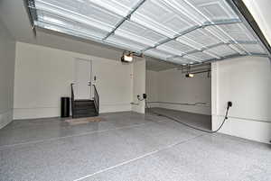 Garage featuring a garage door opener