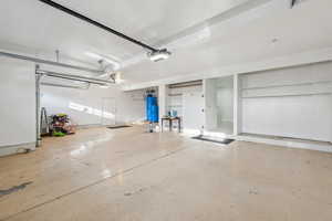 Garage featuring a garage door opener