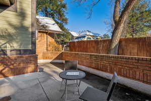 View of patio featuring fence
