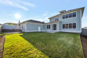 Back of property with a patio