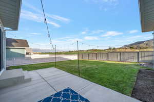 View of yard with a patio area and a mountain view