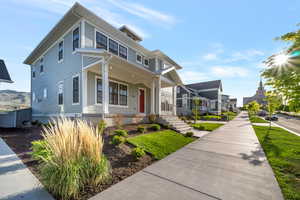 Traditional style home featuring covered porch