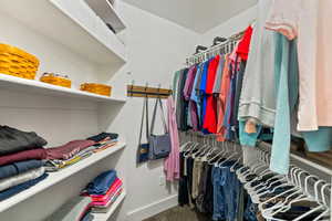 Spacious walk-in closet in primary bedroom