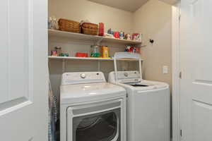 Convenient laundry near upstairs bedrooms with lots of storage