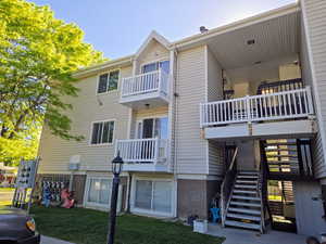 View of property featuring stairway
