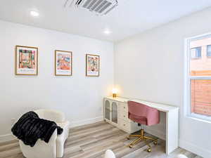 Office featuring recessed lighting, visible vents, light wood finished floors, and baseboards