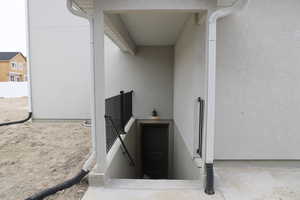 Entrance to property featuring stucco siding