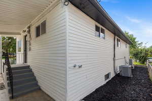 View of property exterior featuring cooling unit
