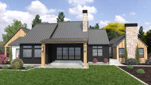 View of front facade featuring a standing seam roof, board and batten siding, a front yard, metal roof, and a chimney