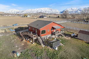 Birds eye view of property with a rural view and a mountain view