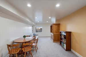 Dining area featuring recessed lighting, baseboards, and light colored carpet