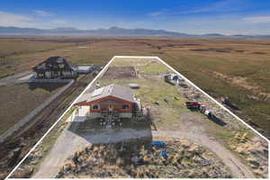 Drone / aerial view with a mountain view and a rural view