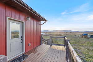 Wooden deck featuring a mountain view