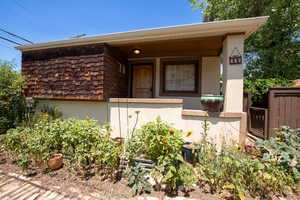 View of front of house featuring stucco siding