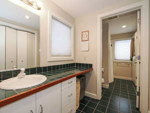 Full Bathroom, Jack and Jill style services both bedrooms Well lit as this level is only partial below grade.
