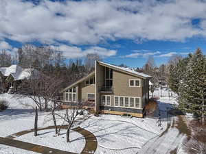 View of front facade with a balcony  off of Main Bedroom for a relaxing start or end of the day