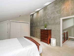 Bedroom 2 featuring vaulted ceiling,  loft to covered deck