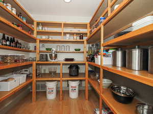 Quality wood work extends even into this spacious pantry