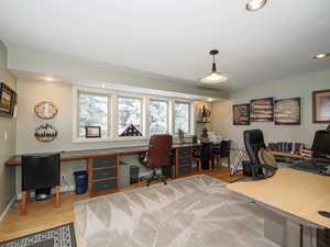 Well appointed office exterior entrance off of side driveway and large windows for a pleasant work zone,
