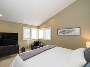 Bedroom 2 featuring vaulted ceiling, room for a  king size bed and furniture