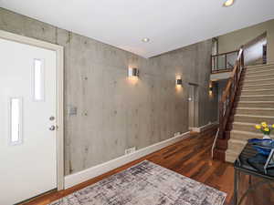 2 story cement wall, open contemporary stair way