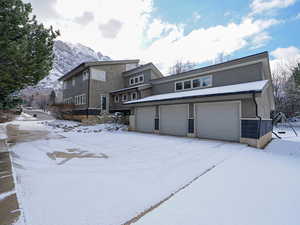 North side load 3 car garage and driveway parking
