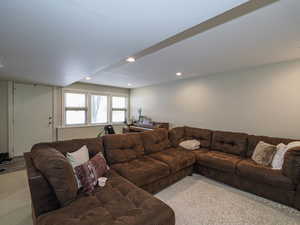 Living room featuring recessed lighting and light carpet