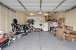 Garage with Sealed Floor, Overhead storage, and Bike rack.