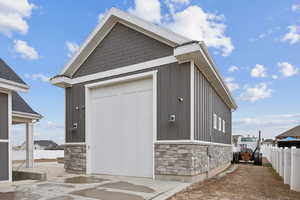 Garage featuring fence
