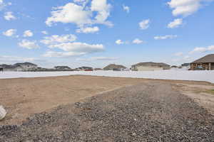View of yard with fence and a residential view
