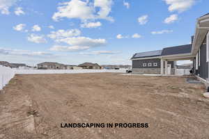 View of yard featuring a residential view and fence