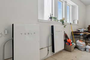 Details featuring unfinished concrete flooring