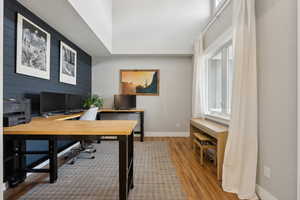 Office area with wood finished floors and baseboards