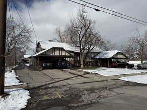 View of front of home featuring a carport and driveway