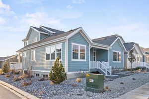 View of front facade with a shingled roof