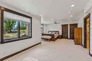 Bedroom featuring light carpet, recessed lighting, and a ceiling fan