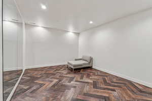 Unfurnished room with baseboards and recessed lighting
