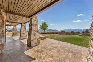 View of patio / terrace with a mountain view