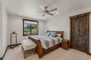 Bedroom with light carpet, recessed lighting, and a ceiling fan